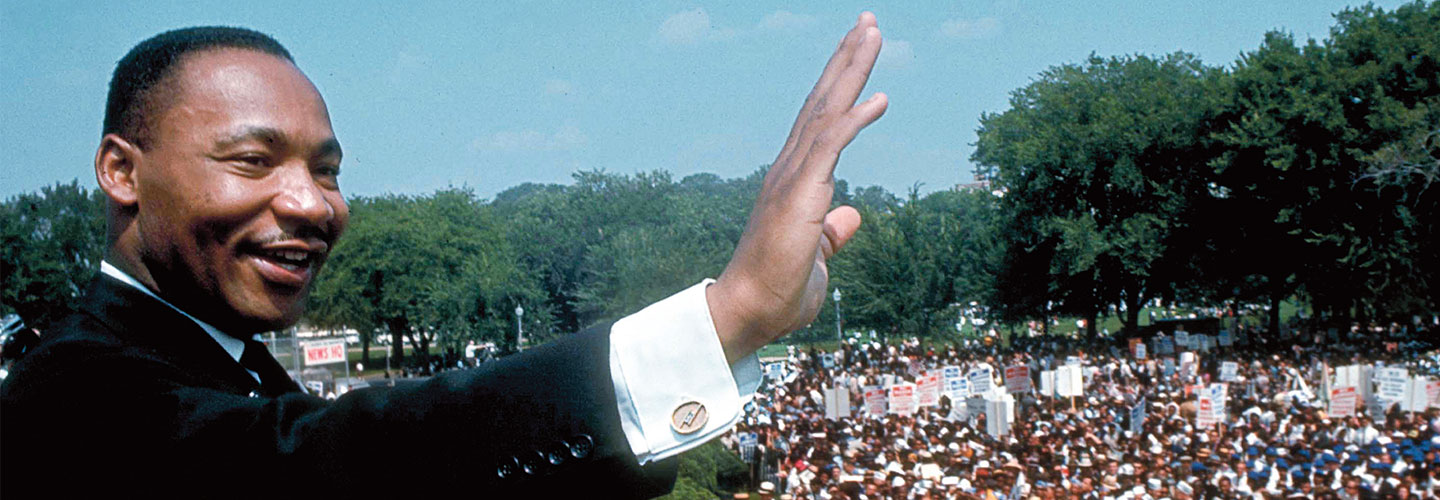 Martin Luther King Jr. speaks in front of a large crowd at the Washington Monument