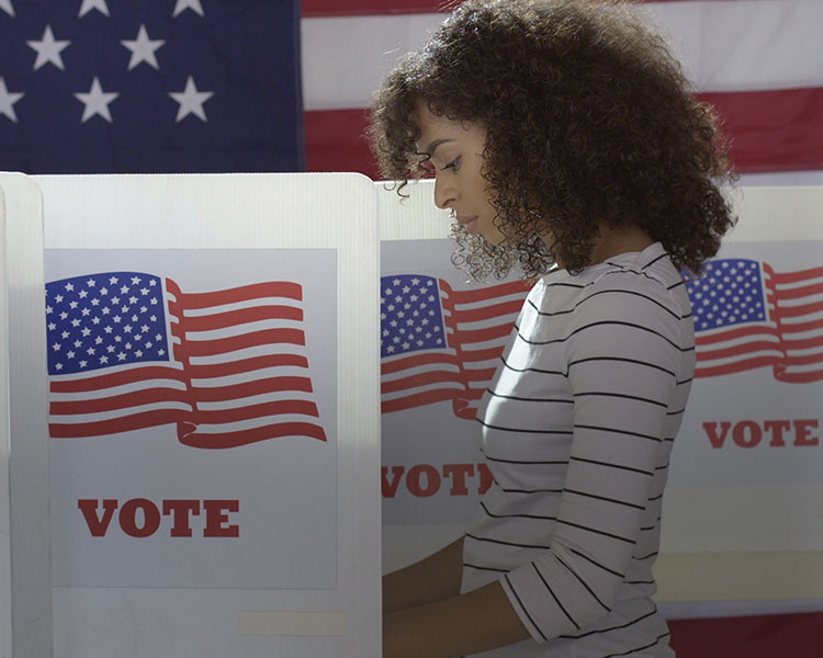 A woman votes.