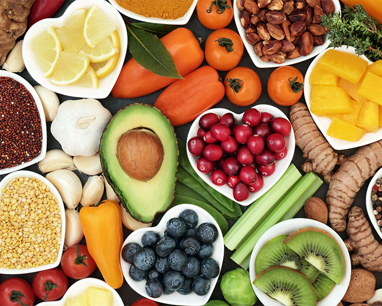 Fruits, nuts, and vegetables such as avocado, grapes, carrots, and almonds.