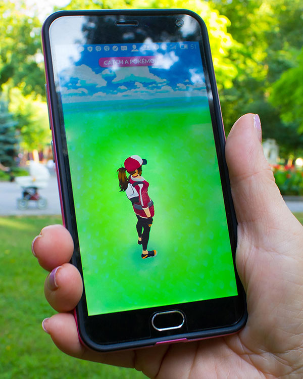 A video game character on a smartphone screen.