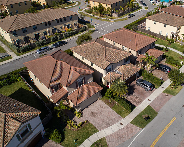 A neighborhood with houses and apartment buildings.