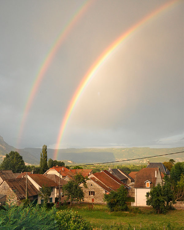 A rainbow over a small town.