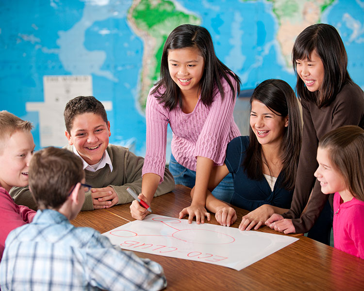 Students working on a poster