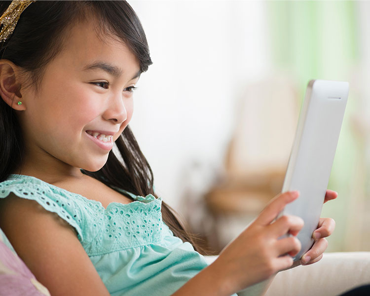 A child reading on a tablet