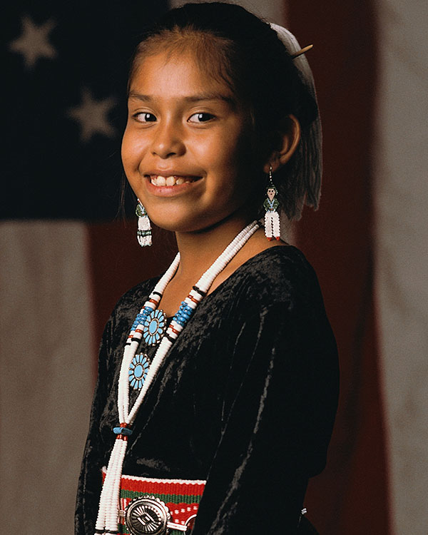 Child dressed in traditional Native American garments