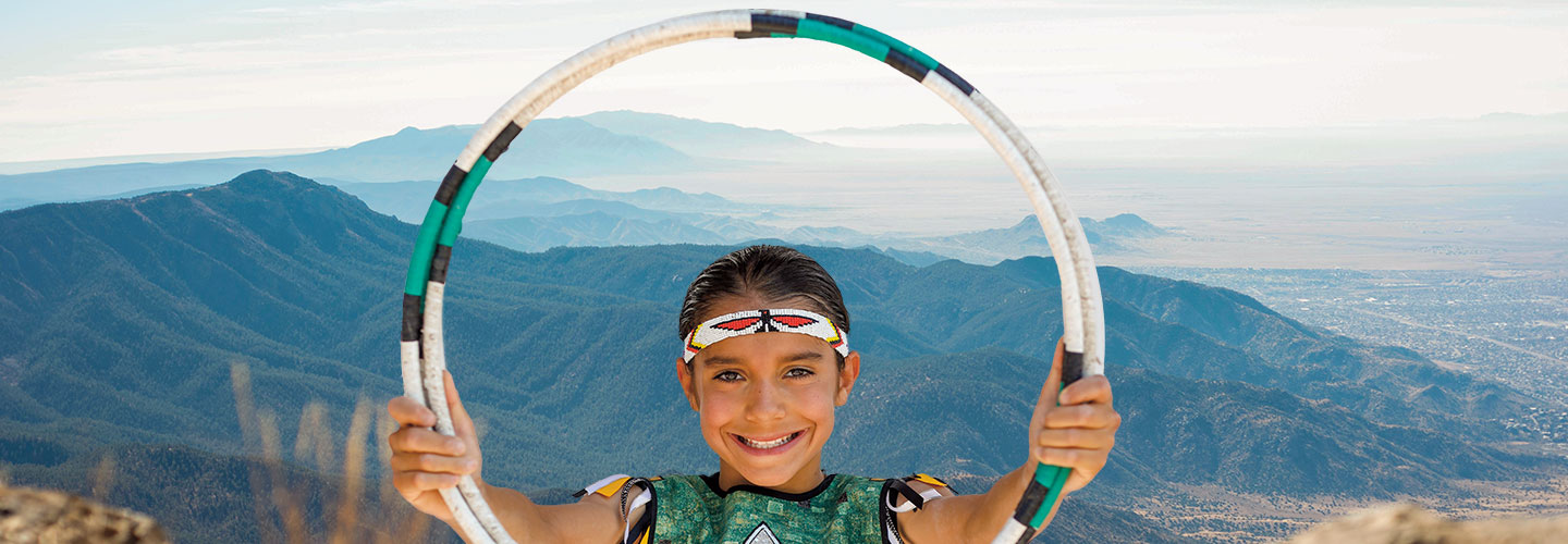 Hoop Dancer posing with his hula hoop