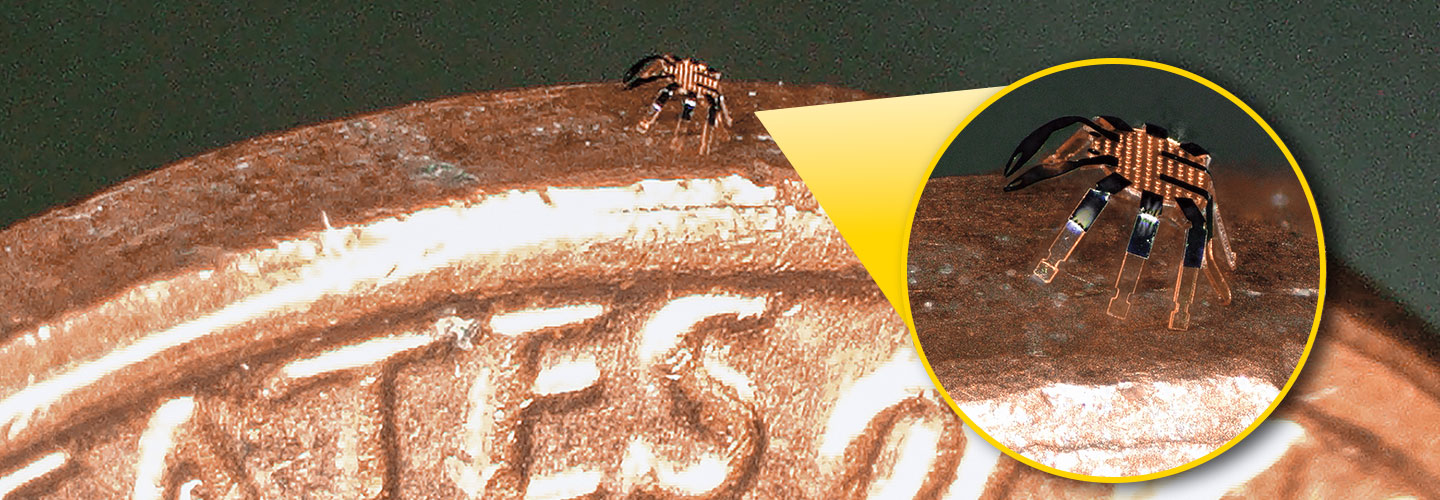 Zoomed in image of a tiny robot walking on a penny