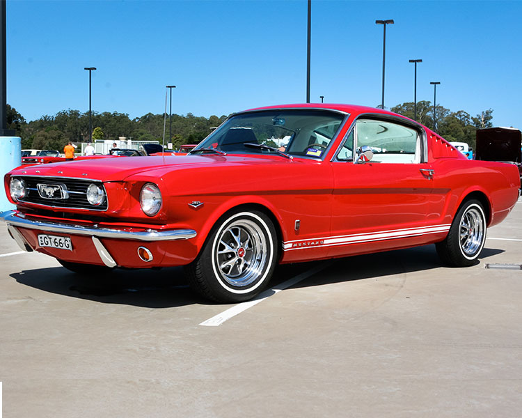 Old model of a shiny red car