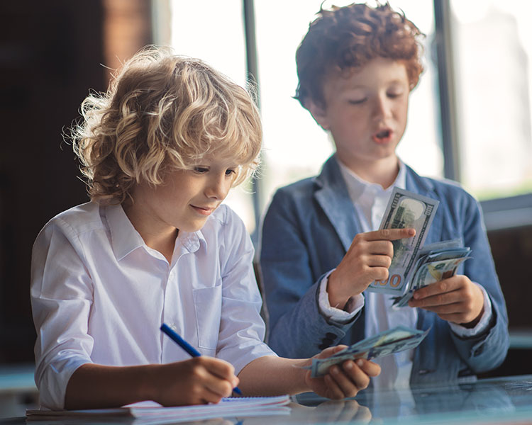 Photo of two kids counting money