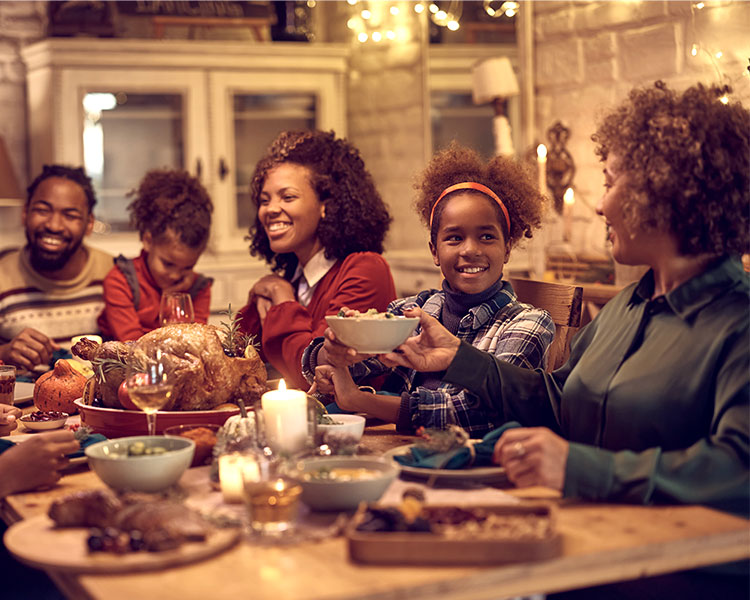 Photo of a family having dinner together