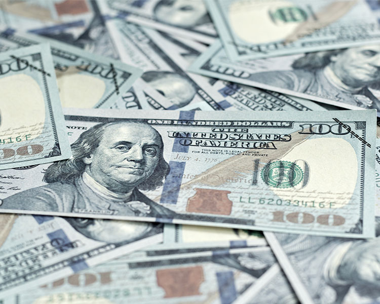 Image of a pile of one hundred dollar bills